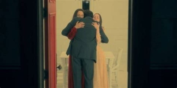 Olivia, Nell, & Hugh embrace in the Red Room in The Haunting of Hill House.