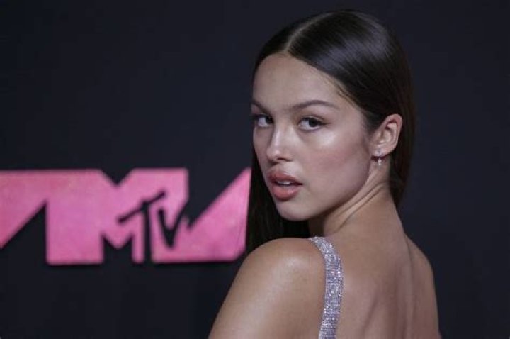Olivia Rodrigo poses on the red carpet