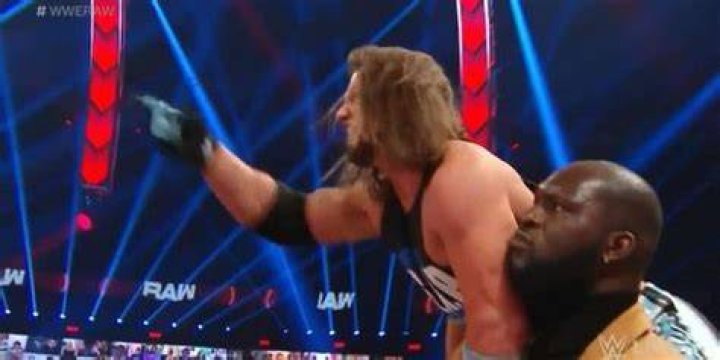 Omos Carrying AJ Styles