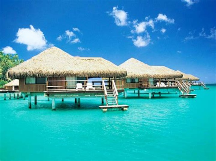 Over-water bungalows are the accommodation of choice at Bora Bora, in the same island chain as Tahiti. Photo / 123rf