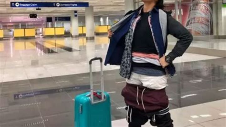 Passenger puts on layers and layers of clothes to avoid excess baggage fees
