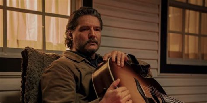 Pedro Pascal as Joel holding Nico Parker's Sarah in The Last of Us episode 1