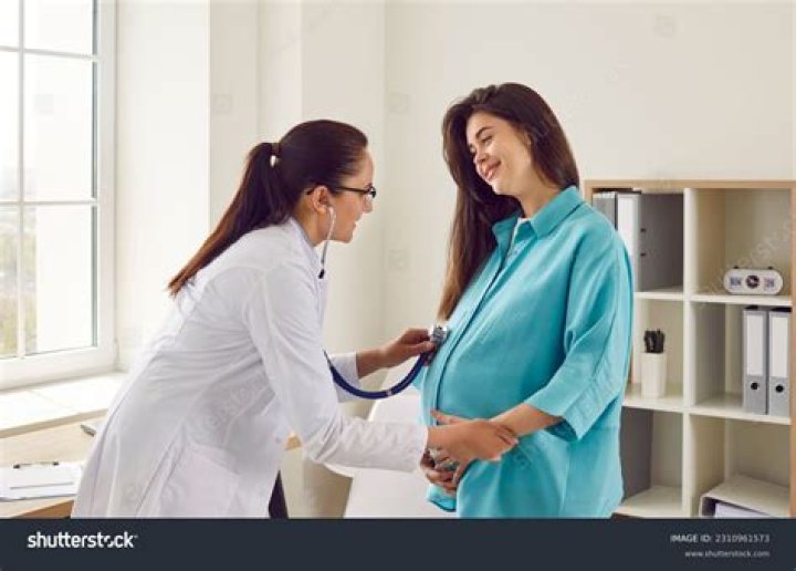 Photos of a pregnant woman posing for a dance.