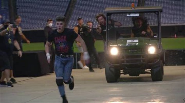 Sammy Guevara chased by Kenny Omega and Matt Hardy in a golf cart
