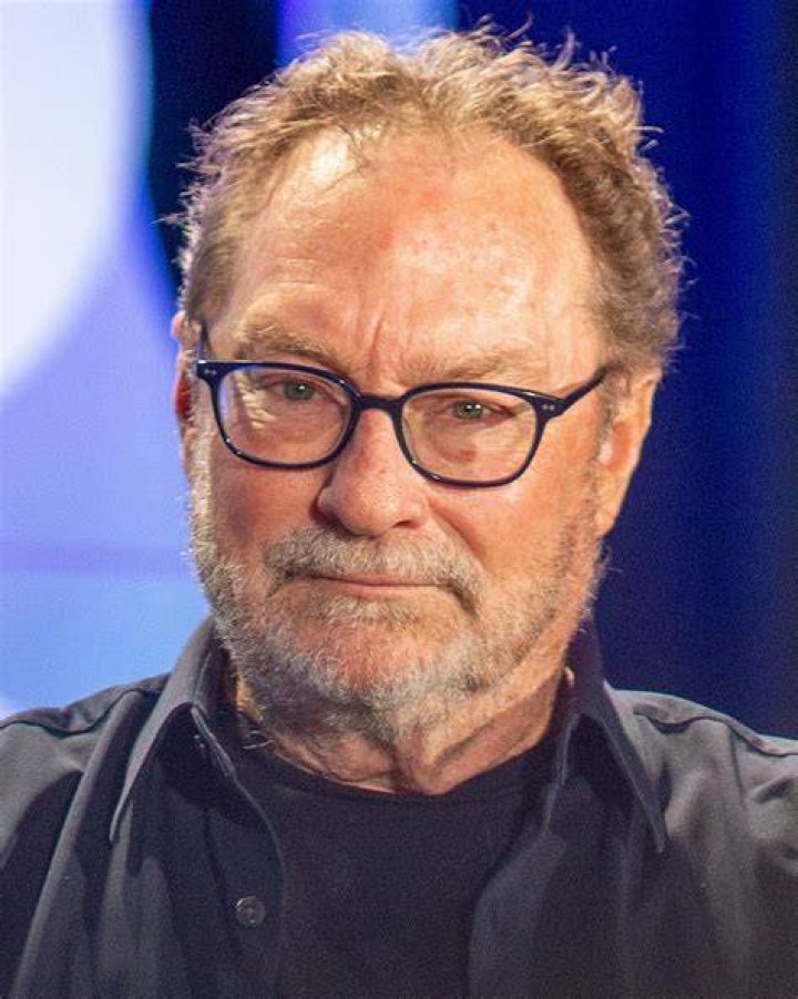 Stephen Root sits in a wheelchair next to Daniel Kaluuya in Get Out