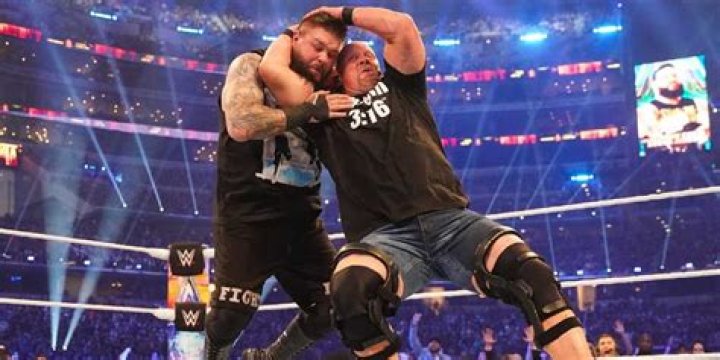 Steve Austin hitting Kevin Owens with a Stunner at WrestleMania 38.