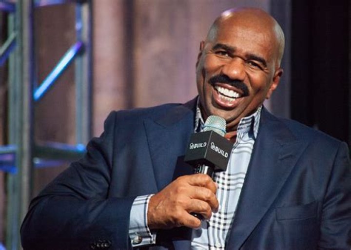 Steve Harvey speaking in microphone