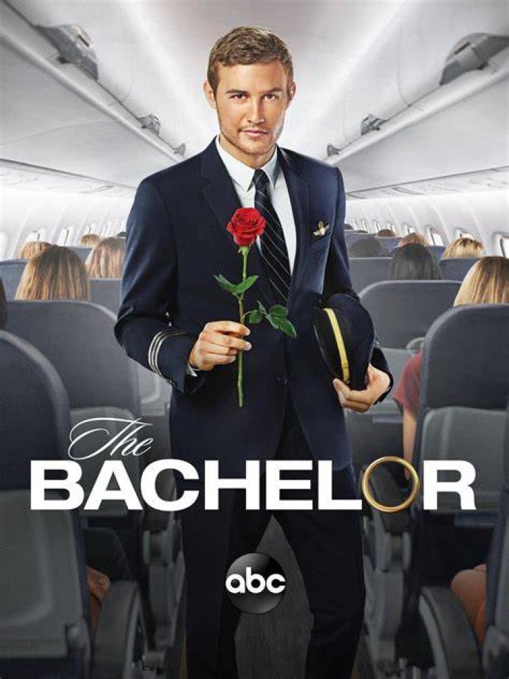 The Bachelor's Juan Pablo Galavis holding a rose smiling