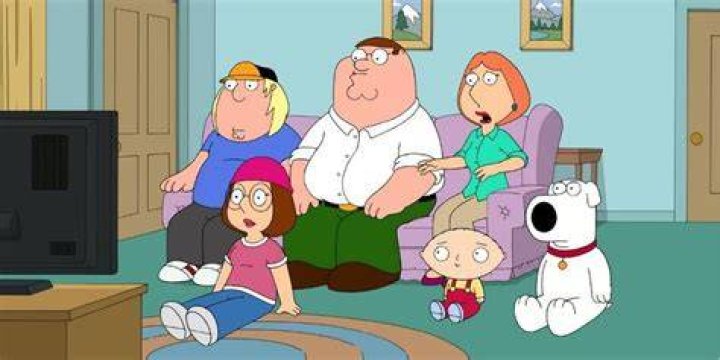 The Griffens sitting around the TV looking shocked