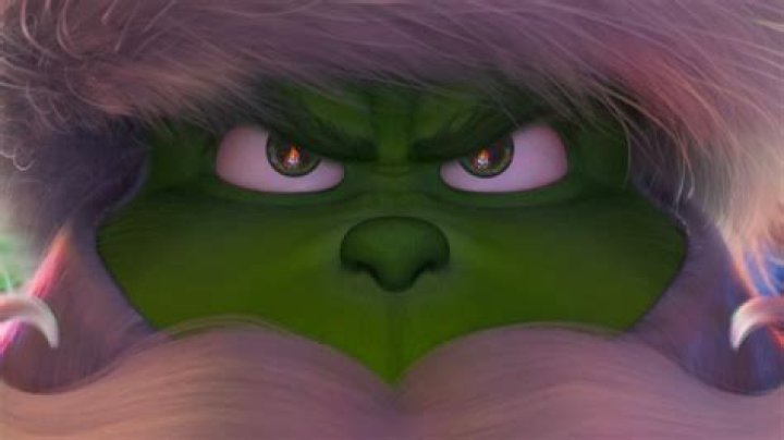 The grinch hides in the Christmas tree