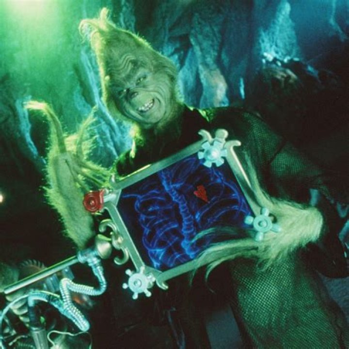 The Grinch on a sofa in his house