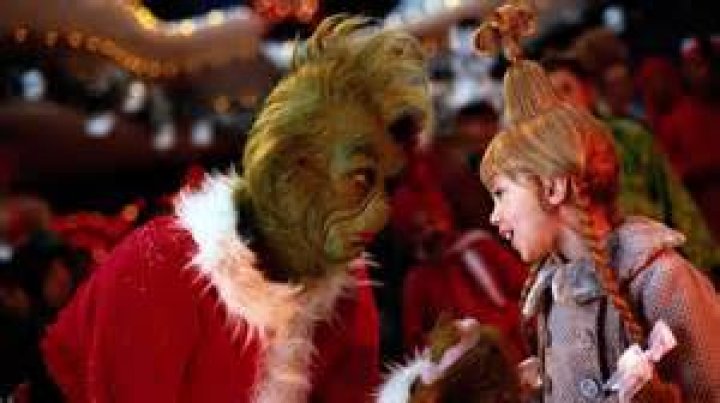 The Grinch talking to Cindy Lou in How the Grinch Stole Christmas