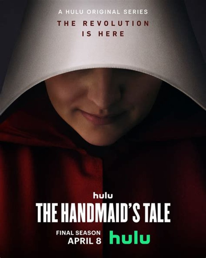 The Handmaid's Tale June standing in front of the wings