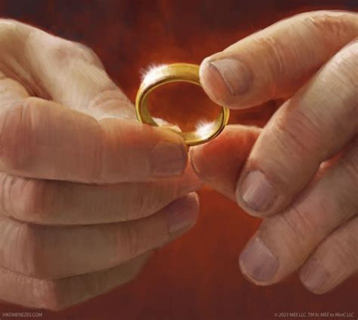 The One Ring from The Lord of the Rings next to Frodo Baggins in Mount Doom