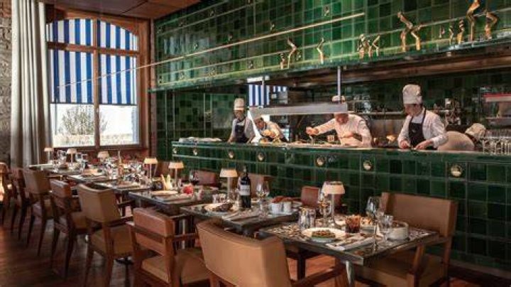 The stunning Eden restaurant kitchen on Celebrity Edge offers a "window-to-the-world" glass panels at the ship's stern, providing passengers with a glorious view of the disappearing horizon. Photo / Supplied