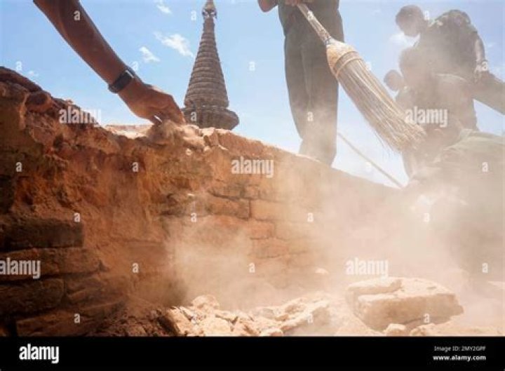 Using brooms and their hands, soldiers and residents of the ancient Myanmar city famous for its historic Buddhist pagodas began cleaning up the debris a powerful earthquake shook the region. Photo: AP