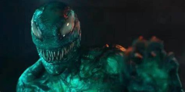 Venom chases a xenophage as it taunts him in a comic book panel