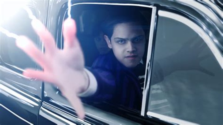 Wednesday in the car with Morticia and Gomez Addams