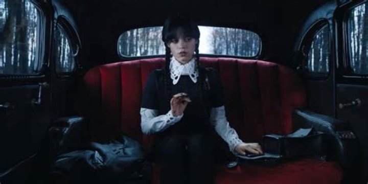 Wednesday sitting in the car