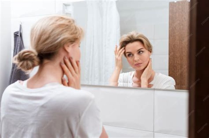 Woman looking in the mirror