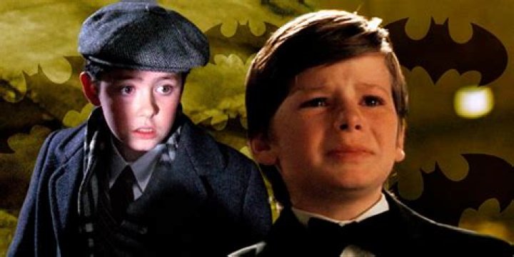 Young Bruce Wayne with young Green Lantern and Superman in the background